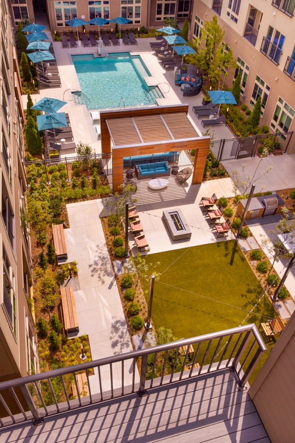 aerial view of courtyard, fire pit and pool from balcony