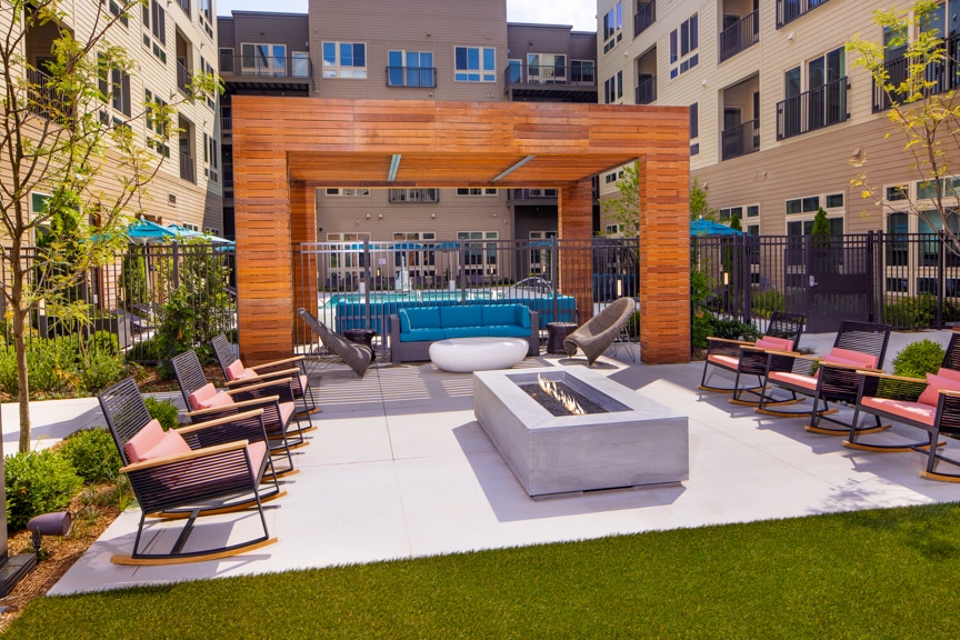 fire pit and rocking chairs in courtyard - south alex luxury apartments alexandria va