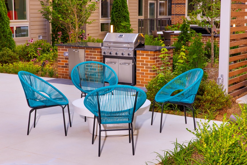 Outdoor grilling area with seating south alex luxury apartments alexandria va