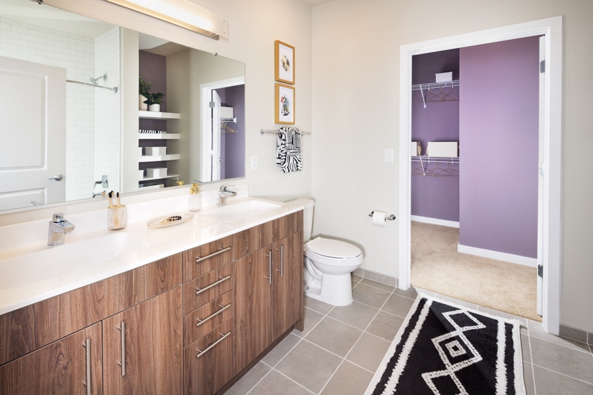 bathroom with double vanity and door to closet - alexandria va luxury apartments south alex
